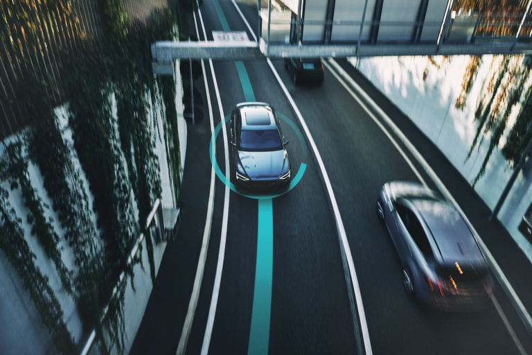A bird's eye view of a car on a highway