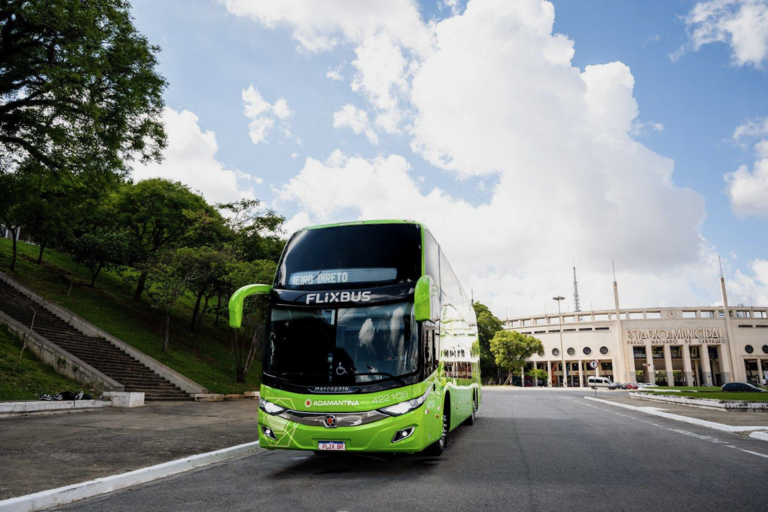 A FlixBus drives along a road in Brazil.