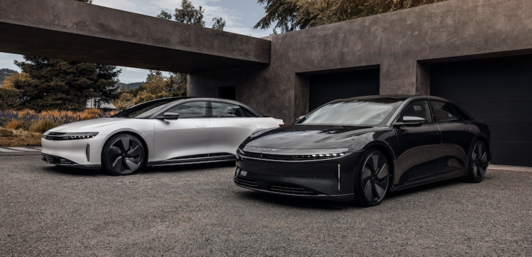 A Lucid Air and Lucid Air Stealth (electric cars) parked in a driveway.