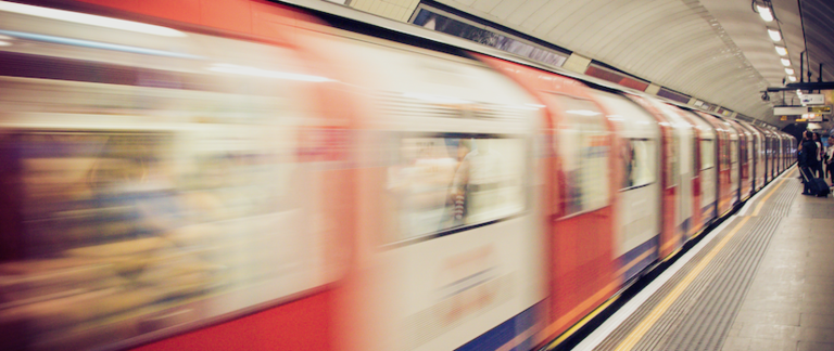A train arrives on the platform of the London Underground