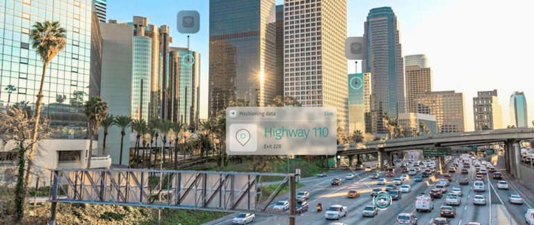 A view of traffic on a city highway with graphic overlay of positioning data.