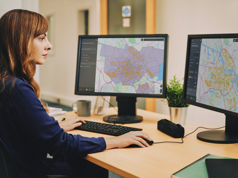 A supply chain manager tracks her company's assets using location technology.