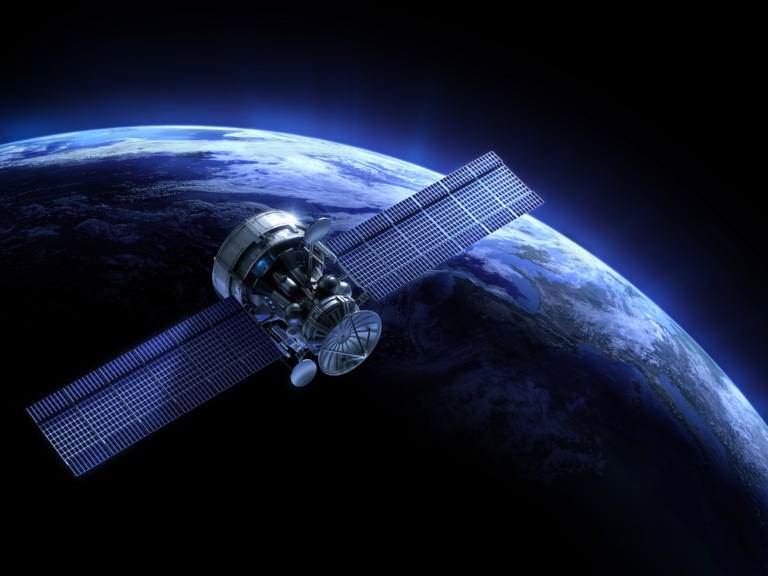 A satellite orbits Earth in space.