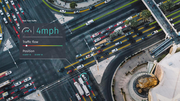 Aerial view of city with traffic flow indicators