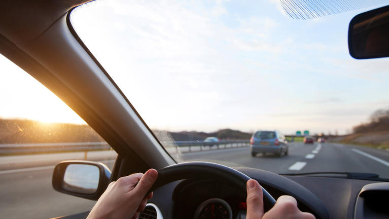 view of the road through the windshield