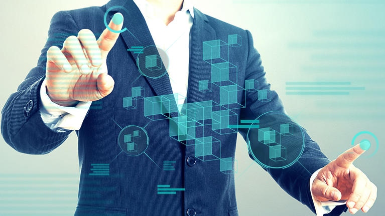 man manipulating data on a screen