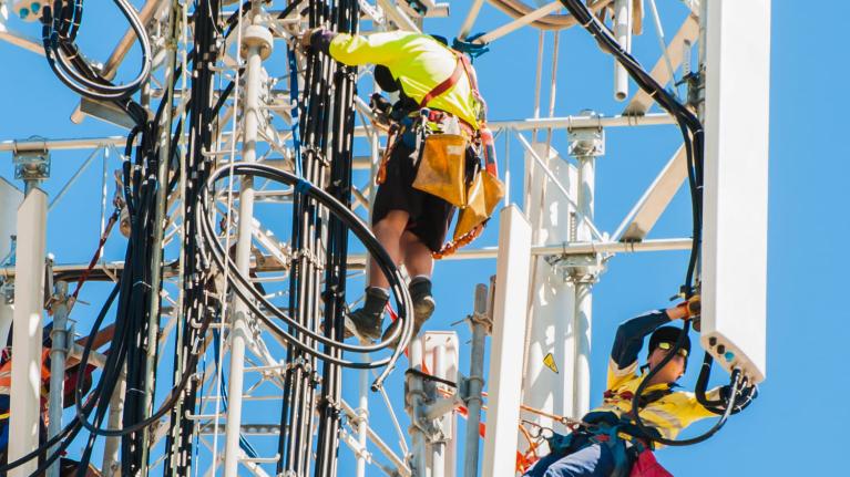 men working on 5G tower