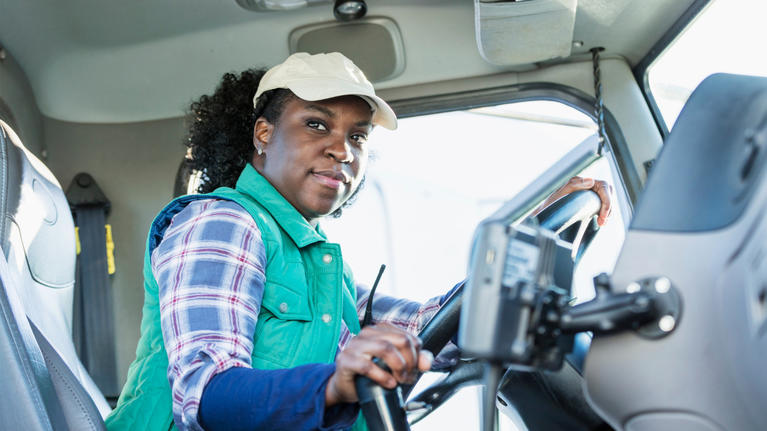 female Black truck driver using HERE Routing
