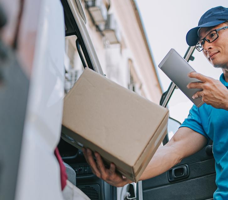 Man scanning a QR code on a package