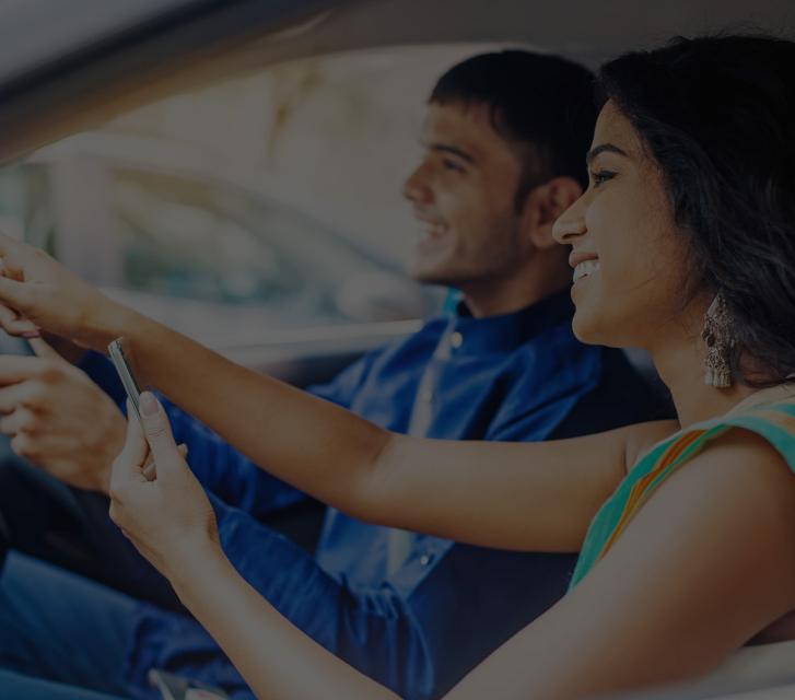Couple in car with mobile phone - Quotes