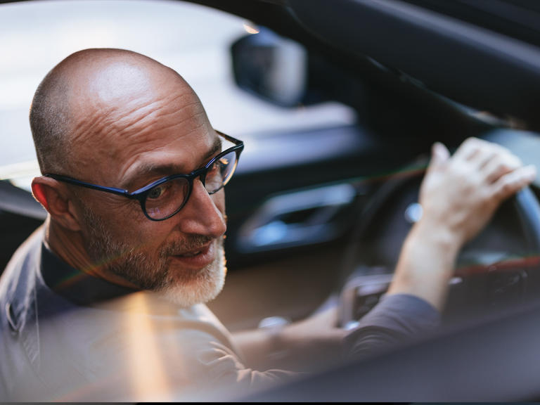 A man driving a software-defined vehicle.